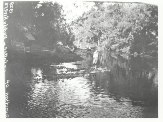 Man standing at the junction of the Cotter and Paddys River