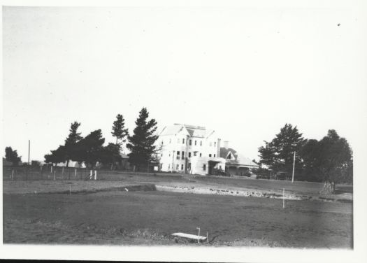 A distant view of Yarralumla, the residence of the Governor General
