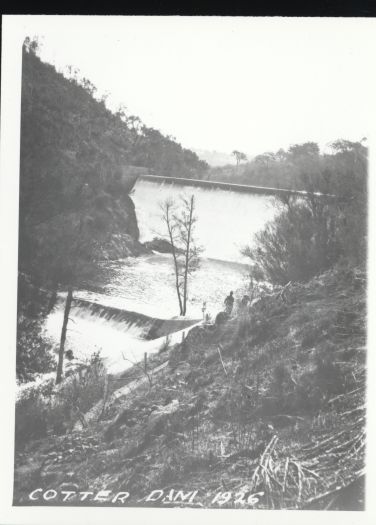Cotter Dam with water running over the wall