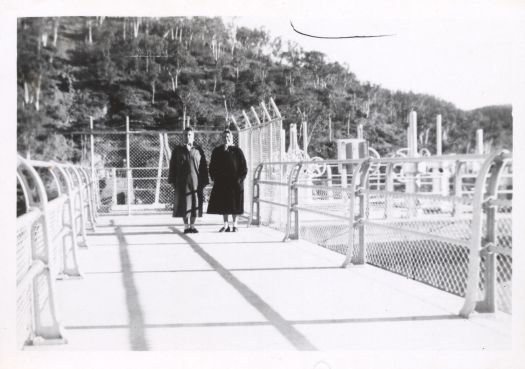 Two women standing on the Cotter Dam