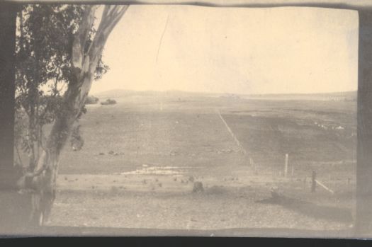 On a hill looking across open ground, site unknown