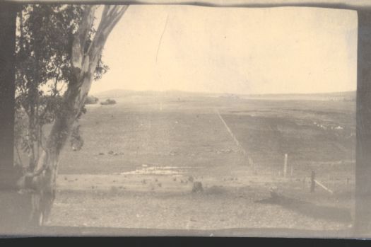 On a hill looking across open ground, site unknown