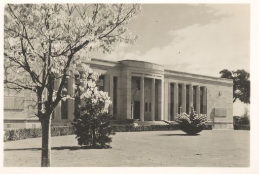 Front view of the Institute of Anatomy showing blossoming trees