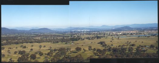 View from Oak Hill, on the NSW border, to Gungahlin and Yerrabi Pond. Black Mountain and Civic are in the distance.