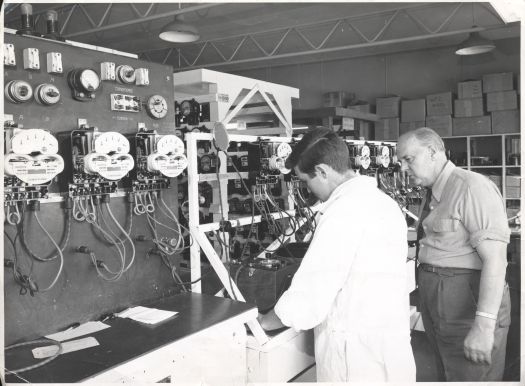 Canberra Diesel Power Station showing Jack Benson and Bob Smith in front of a control panel.