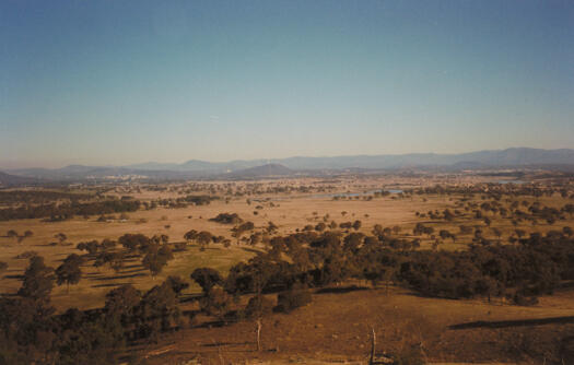 View from Oak Hill, on the NSW border, to Gungahlin and Yerrabi Pond. Black Mountain and Civic are in the distance. Forest View is mid left of the photo.