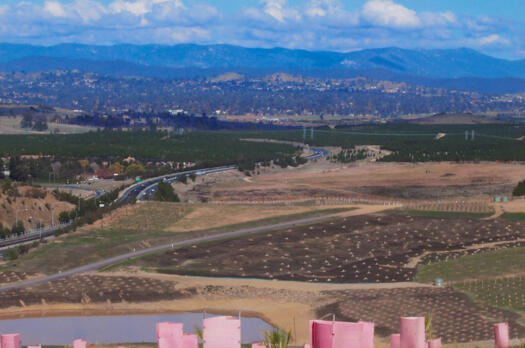 View south from the top of the Arboretum access road across dam, Tuggeranong Parkway, National Zoo and pine forests to Weston Creek