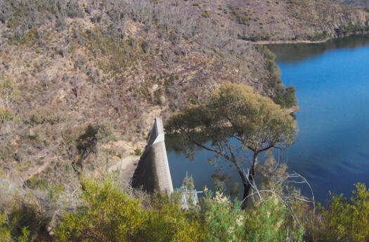 Cotter Dam wall from directly above on Mt McDonald showing water behind the wall