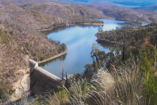 Cotter Dam wall from above on Mt McDonald showing water behind the wall
