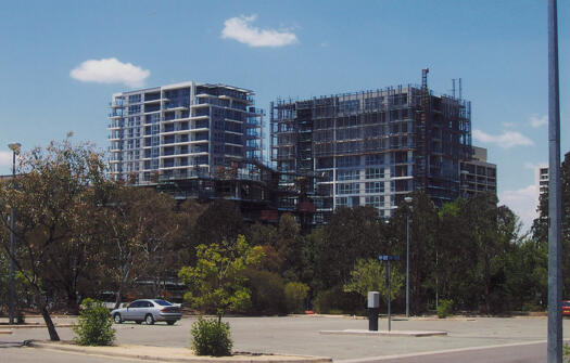 Metropolitan Apartments under construction from NW in carpark across Marcus Clarke Street, Civic