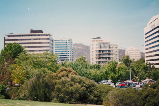 Slopes of City Hill towards South Building car park. Mt Ainslie at rear.