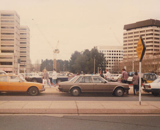 View across Ainslie Avenue to car park on Section 38. Caga Centre at left and Boulevard at right.