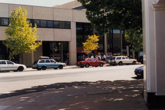 People lined up outside Canberra GPO on Alinga Street