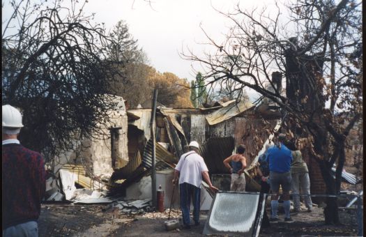 Collection of 24 photographs taken around the Tidbinbilla Nature Reserve, Nil Desperandum, Rock Valley and Flints Picnic Ground showing the aftermath of the fires of 17-18 January 2003.
Members of the Tidbinbilla Pioneers Association were shown around the area shortly after the fires.