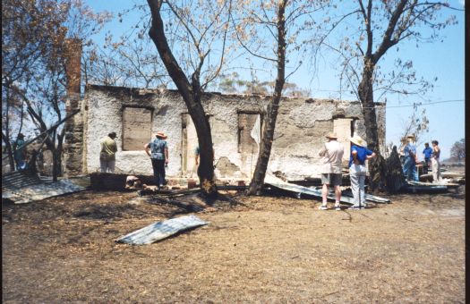 Collection of 24 photographs taken around the Tidbinbilla Nature Reserve, Nil Desperandum, Rock Valley and Flints Picnic Ground showing the aftermath of the fires of 17-18 January 2003.
Members of the Tidbinbilla Pioneers Association were shown around the area shortly after the fires.