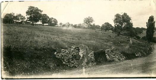 View of limestone outcrop from Lennox Crossing Road. Acton cottages also visible and possible lime kiln.