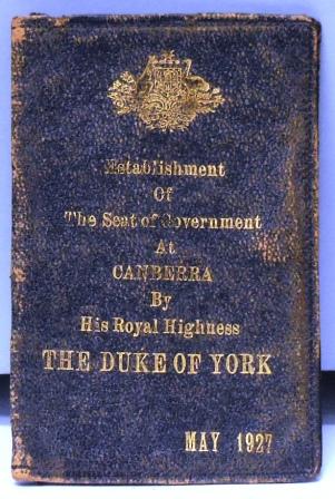 Small wallet stamped with Commonwealth arms and "Establishment of the Seat of Government at Canberra by His Royal Highness the Duke of York May 1927". Leather, silk ,elastic.