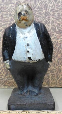Statuette of former Prime Minister George Reid, 5 cm x 12 cm. Hand painted, damaged, probably used as a paper weight.