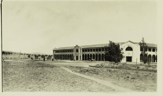 Mid distance photograph taken from the north east. Three cars (c1920s) are on East Row and City Hill is to the left.