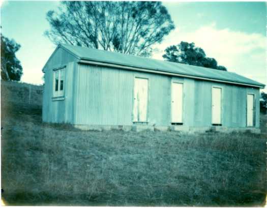 View of the shearer's quarters at Aroma. There are four doors suggesting four separate rooms.