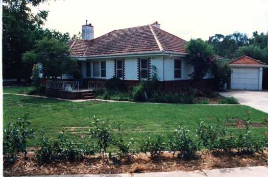 Original brick rendered house probably in Reid, showing its original garage