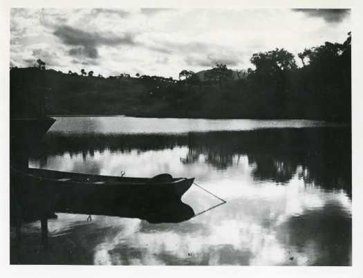 Boat in shadows above the Cotter Dam wall