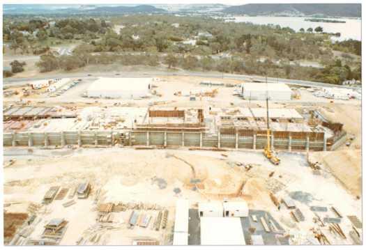 View from a crane of construction work on the Senate chamber looking towards Yarralumla and Lake Burley Griffin