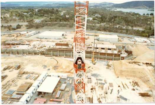 View from a crane of construction work on the Senate chamber looking towards Yarralumla and Lake Burley Griffin