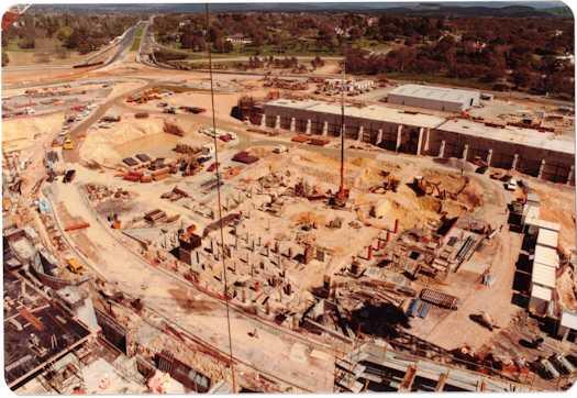 View from a crane of the foundations of buildings on the Senate side. Adelaide Avenue is visible.
