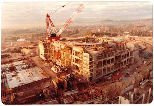 View from a crane towards construction work on the House of Reps side of the building. Part of the building has reached three levels.