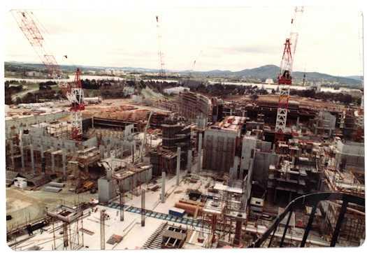 View from a crane over the Ministerial wing looking towards Commonwealth Avenue. The Senate is at left. The building has risen two to three levels.