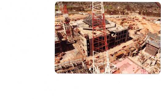 View from a crane towards construction work on the House of Reps side of the building. Part of the building has reached three levels.
