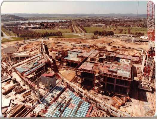View from a crane over the Ministerial wing looking towards Brisbane Avenue over the House of Reps buildings which have risen two to three levels.
