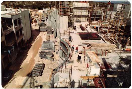 Three workmen in the vicinity of the Press Gallery, looking south towards Ministerial wing. There is a gap between it and the House of Reps.