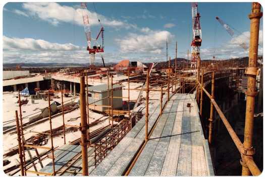 View to south east of scaffolding along curved wall on the Senate side. To the left is the Forecourt and the structure over the Members' Hall is in the centre.
