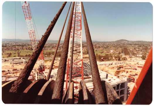 View of a crane from behind its cables looking towards Forrest