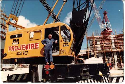 Crane operator standing next to his crane cabin
