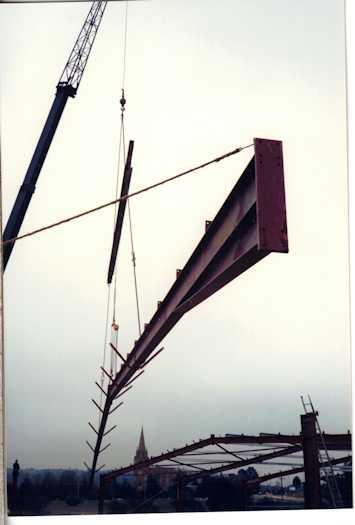 Crane lifting a girder