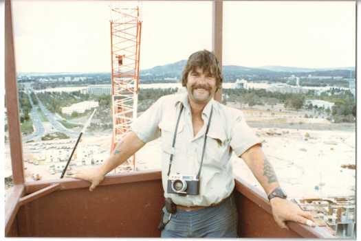 Dogman standing in the crane dog box with Commonwealth Avenue in the distance