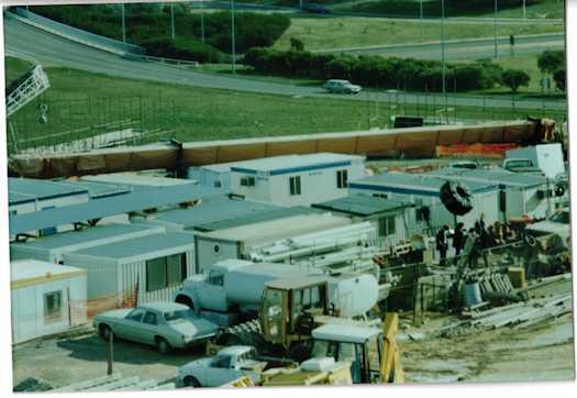 Worker's crib rooms. A car can be seen travelling down Adelaide Avenue onto Capital Circle.