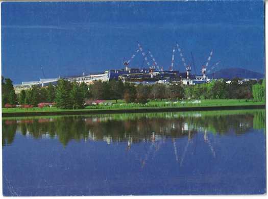 View from Acton Peninsula to Capital Hill showing multiple cranes working on the building
