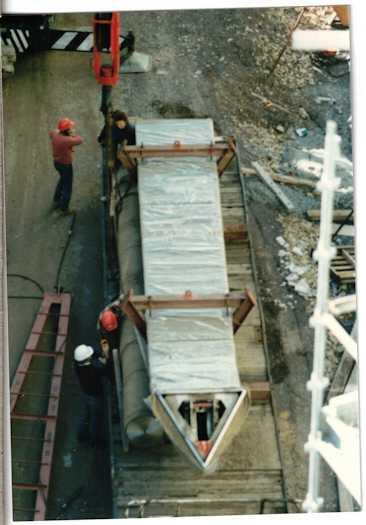 Part of the flag pole on the ground ready to be raised by a crane