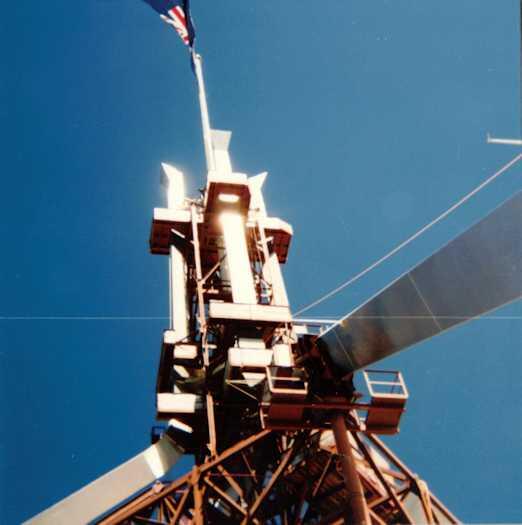Flag pole viewed from below with a flag flying at the top