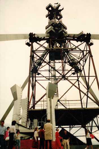 View from below of the flag pole surrounded by scaffolding