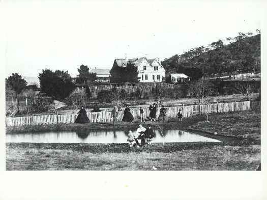 Original (1833) and 'new' (1862) sections of the homestead, with the family posed in front.