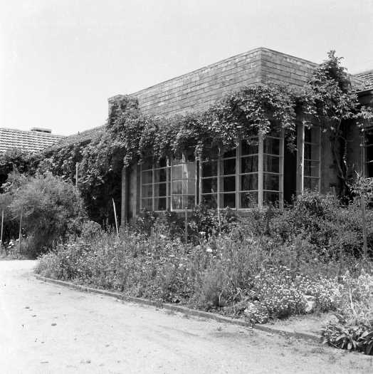 Shows a key feature of Heather Henderson's functionalist design - steel framed corner windows.