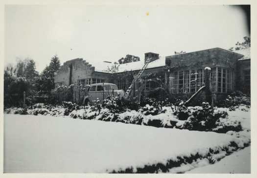 Also shows Pattie Tillyard, car and ladder to roof.