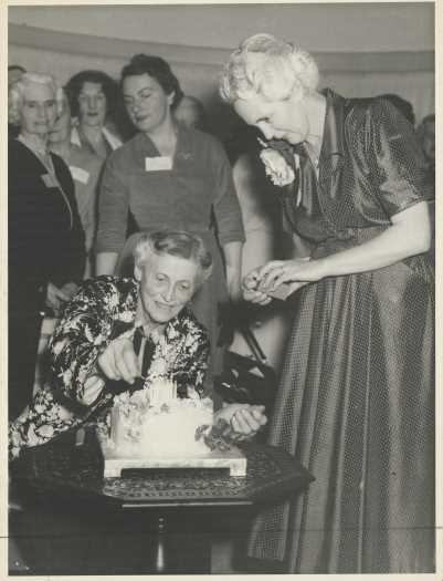 Pattie Tillyard celebrating her 75th birthday on 31 August 1955 at a surprise party hosted at the home of Mrs HL White. 70 women were invited.