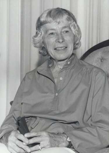 Portrait photo of Pat Wardle sitting in a chair at her Couvreur St home in Garran.