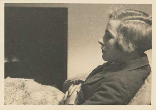 Pat sitting in a chair with cat on lap